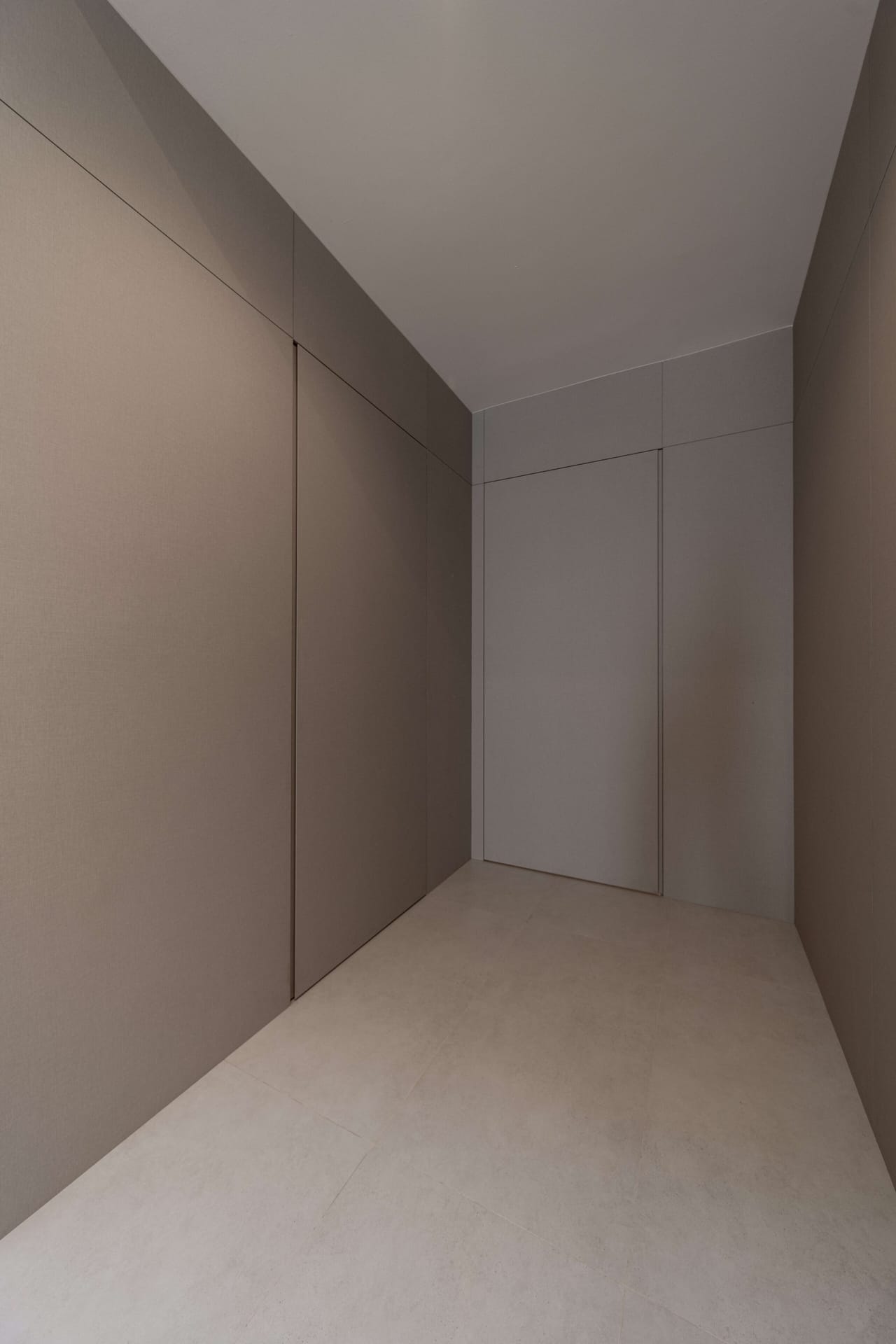 Concealed bomb shelter door flush-mounted with fluted architectural feature wall